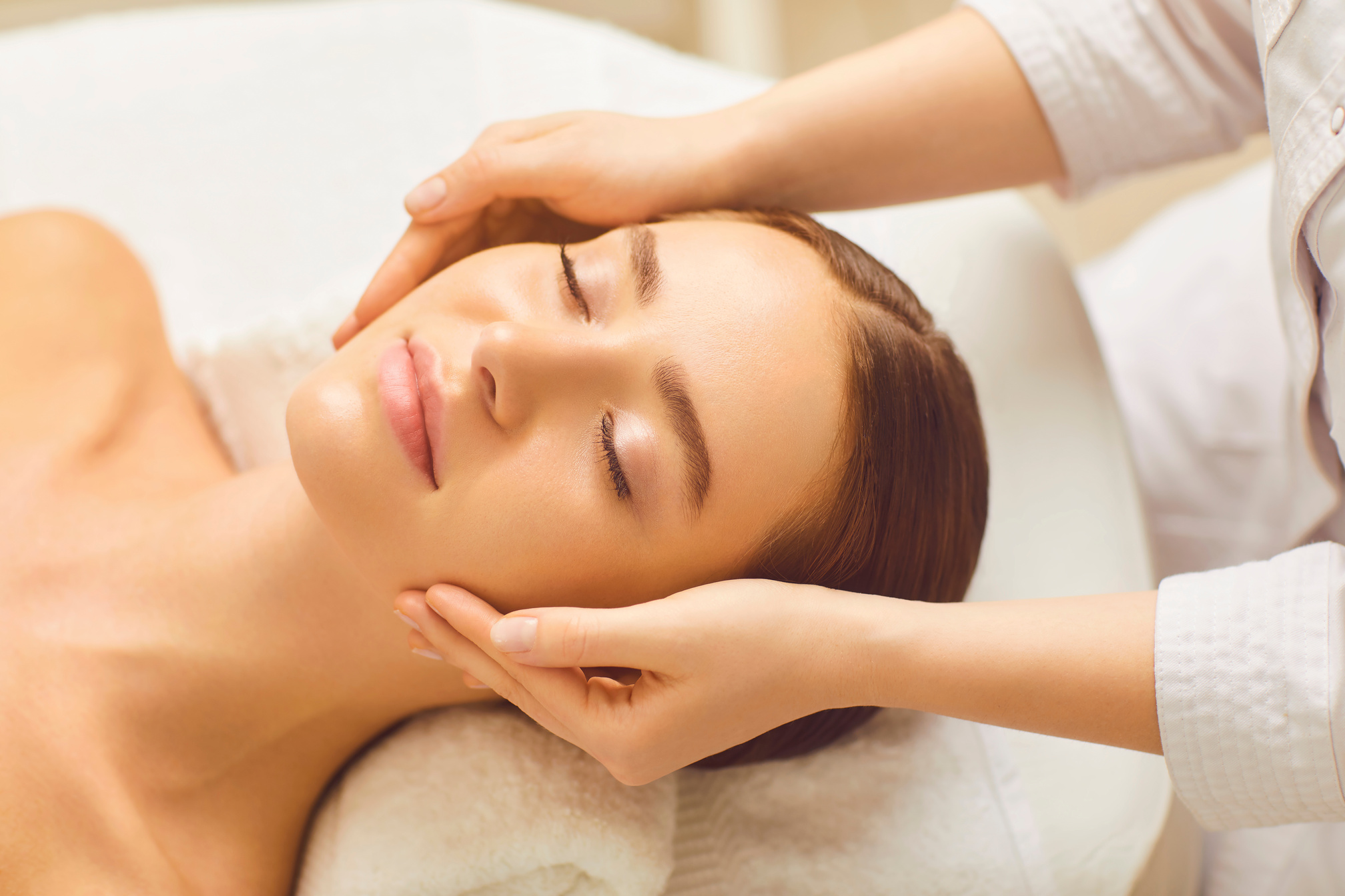 Face Woman Massage Relax Close up in a Beauty Clinic.